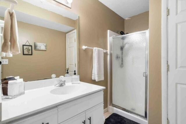 bathroom with vanity and an enclosed shower