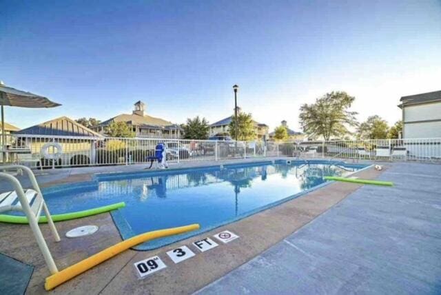 view of swimming pool featuring a patio area