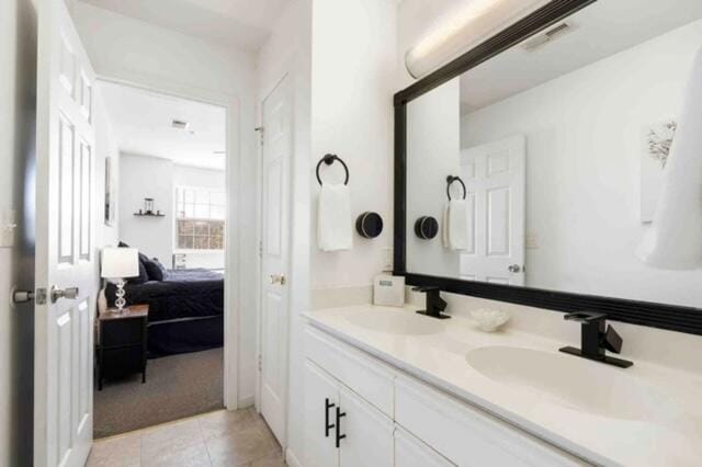 bathroom featuring vanity and tile patterned flooring