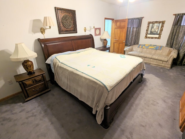 bedroom featuring dark colored carpet