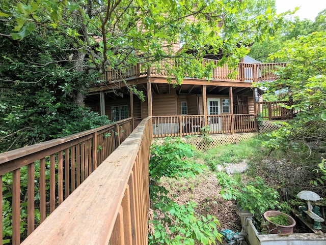 rear view of property with a wooden deck