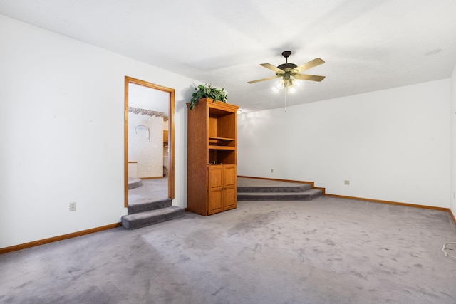 127 Kachina Trl, Branson West, MO 65737 - unfurnished living room with a ceiling fan, baseboards, and light carpet