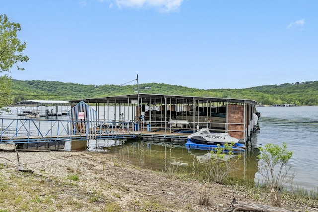 127 Kachina Trl, Branson West, MO 65737 - dock area featuring a wooded view and a water view