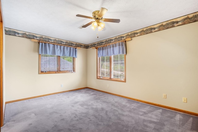 127 Kachina Trl, Branson West, MO 65737 - spare room with carpet flooring, baseboards, a ceiling fan, and a textured ceiling