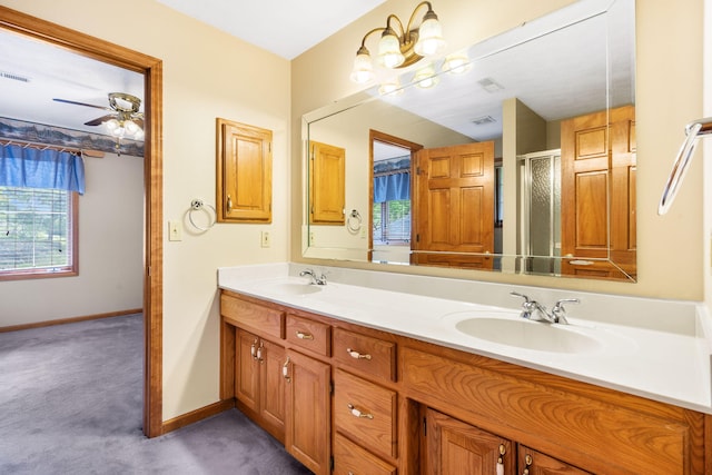 127 Kachina Trl, Branson West, MO 65737 - full bath with baseboards, a shower with door, double vanity, and ceiling fan