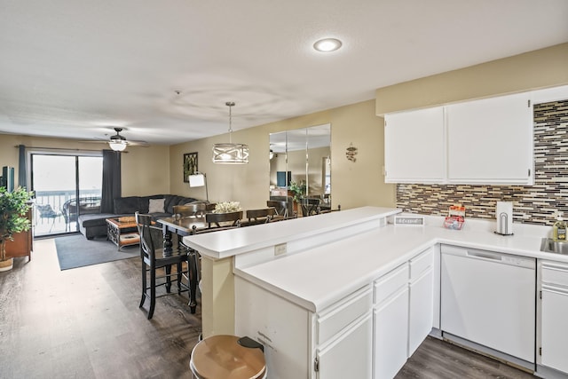 170 Bunker Ridge Dr Unit 6, Branson, MO 65616 - kitchen with white dishwasher, light countertops, dark wood-style flooring, and a peninsula