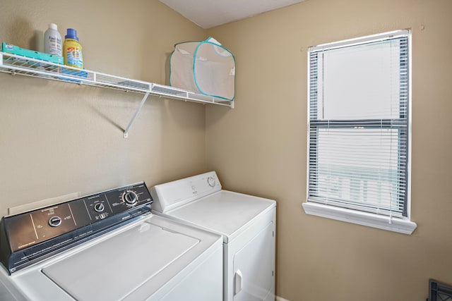 washroom with washer and dryer