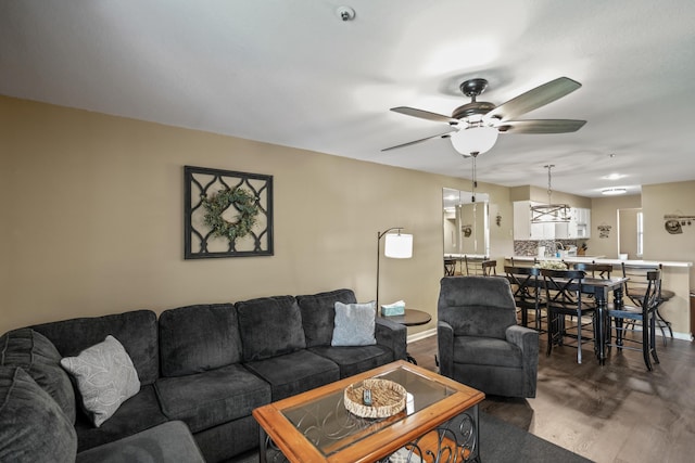 170 Bunker Ridge Dr Unit 6, Branson, MO 65616 - living area with ceiling fan, baseboards, and wood finished floors