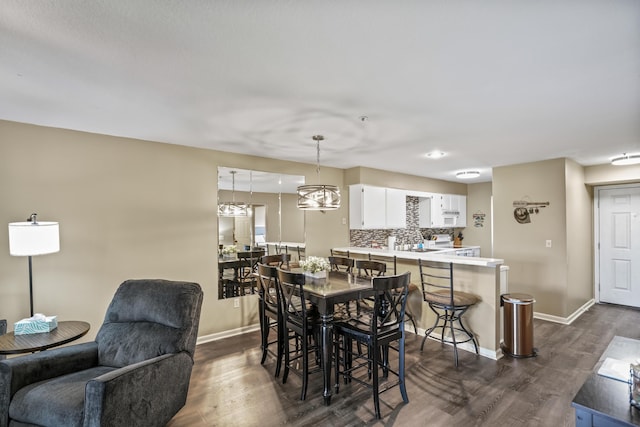 170 Bunker Ridge Dr Unit 6, Branson, MO 65616 - dining room with baseboards and dark wood finished floors