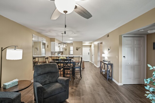 170 Bunker Ridge Dr Unit 6, Branson, MO 65616 - living area with ceiling fan, visible vents, baseboards, and dark wood-style flooring
