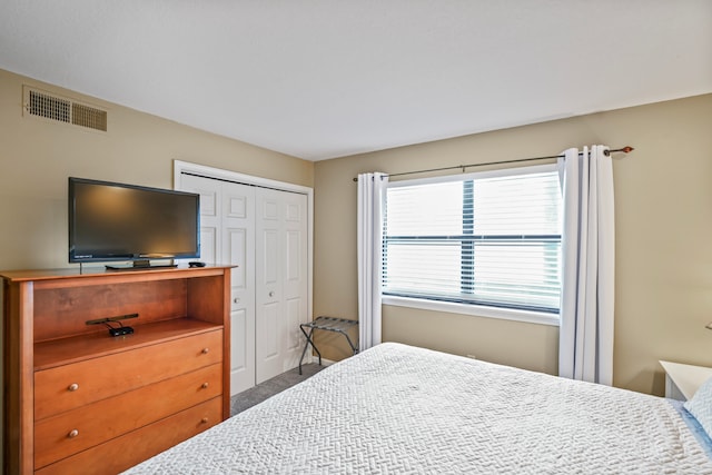 bedroom with a closet and carpet