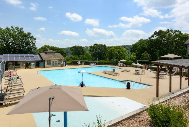 view of pool featuring a patio