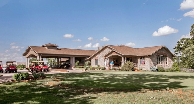 rear view of house featuring a yard