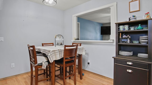 dining space featuring light hardwood / wood-style floors