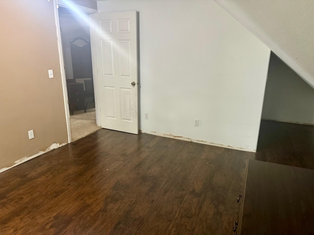 bonus room with dark hardwood / wood-style floors