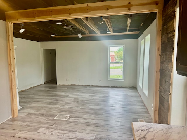 unfurnished room with light wood-type flooring