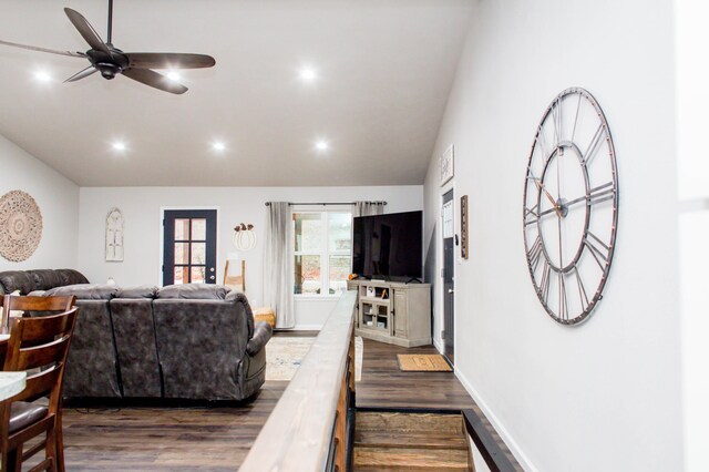living area featuring a ceiling fan, recessed lighting, and dark wood finished floors