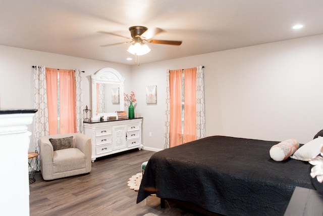 bedroom featuring recessed lighting, wood finished floors, baseboards, and ceiling fan