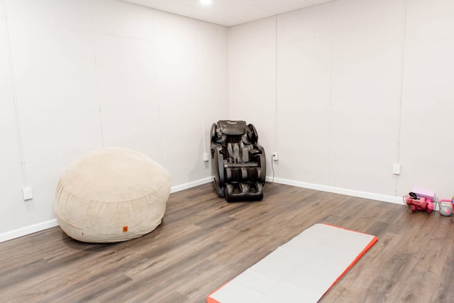 interior space with wood finished floors and baseboards
