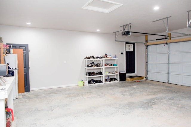 garage featuring recessed lighting and a garage door opener