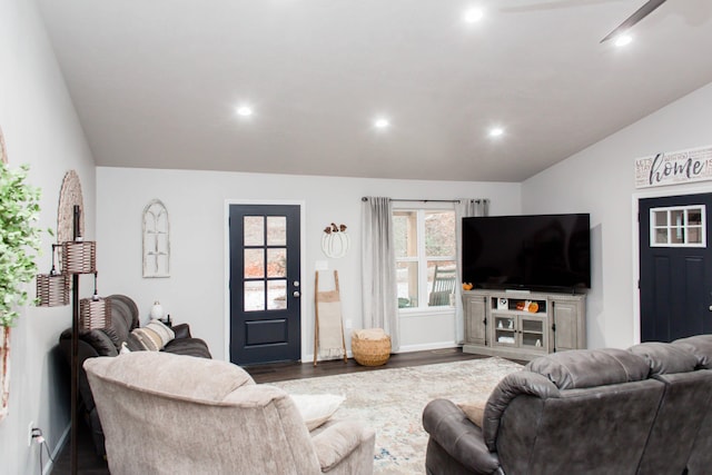 living area with dark wood finished floors, lofted ceiling, baseboards, and recessed lighting