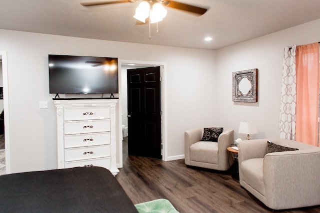 interior space with a ceiling fan, baseboards, recessed lighting, and dark wood-type flooring