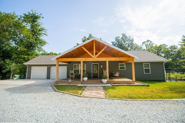 view of front of property with concrete driveway, an attached garage, and a front yard