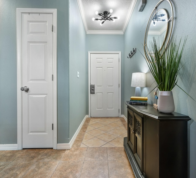 tiled foyer with a notable chandelier and ornamental molding