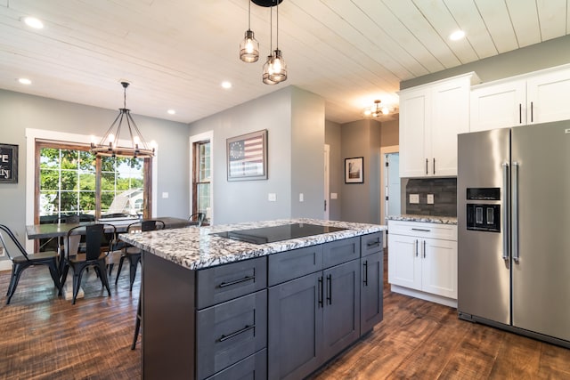 kitchen with pendant lighting, black electric cooktop, stainless steel fridge with ice dispenser, and white cabinetry