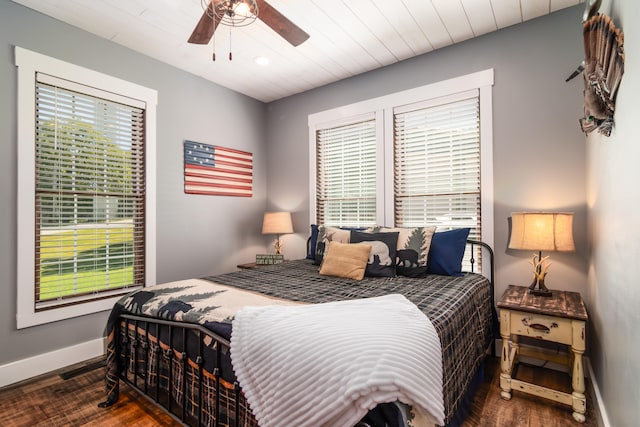 bedroom featuring ceiling fan and dark hardwood / wood-style floors