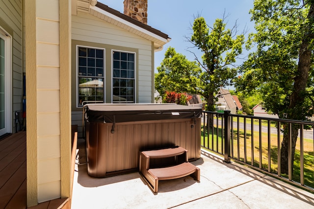 view of patio / terrace with a hot tub