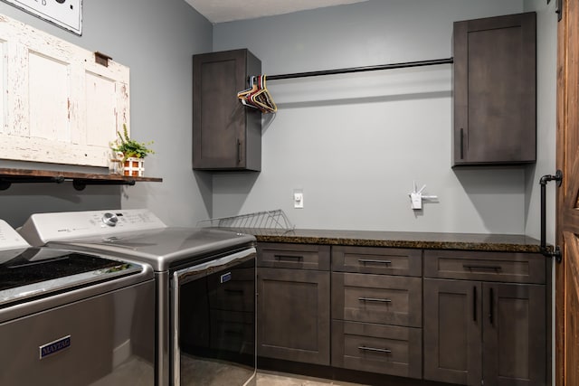 laundry area with independent washer and dryer and cabinets