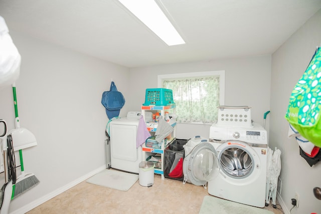 clothes washing area with independent washer and dryer