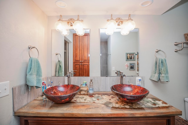 bathroom with toilet and vanity