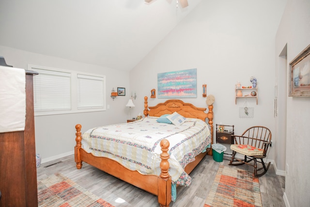 bedroom with high vaulted ceiling, light wood-type flooring, and ceiling fan