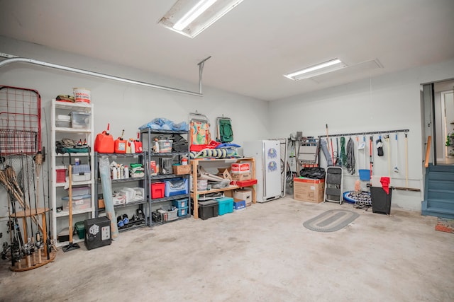 garage with white refrigerator