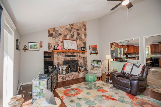 living room featuring high vaulted ceiling, ceiling fan, and wood-type flooring