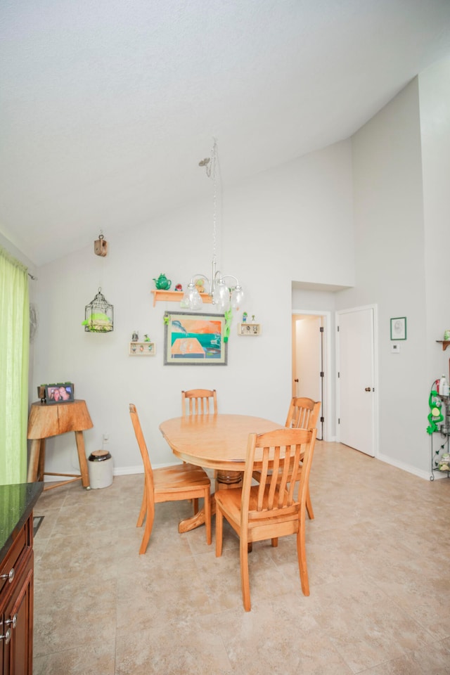 dining space with vaulted ceiling and a chandelier