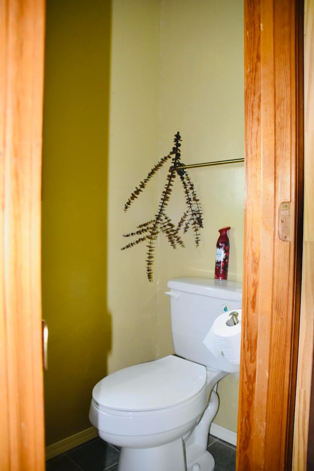 bathroom with tile patterned flooring and toilet