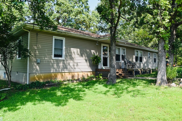 single story home featuring a front yard