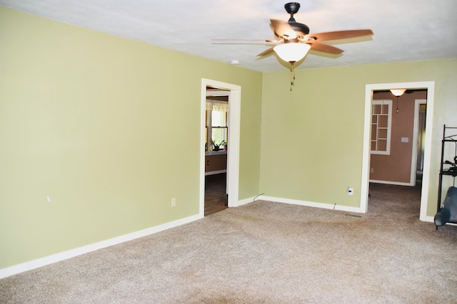 carpeted empty room with ceiling fan