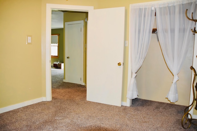 unfurnished bedroom featuring carpet floors