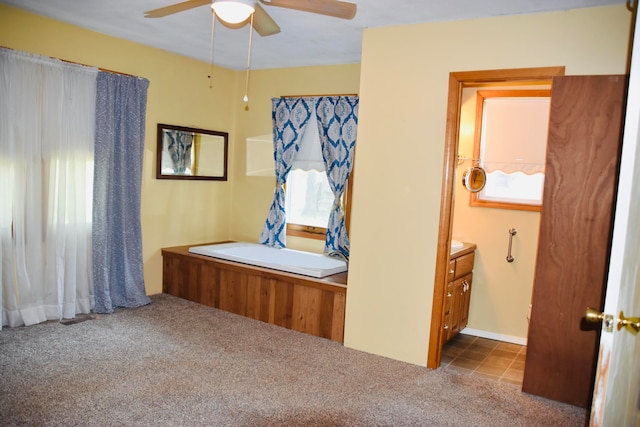 unfurnished bedroom featuring carpet flooring and ceiling fan