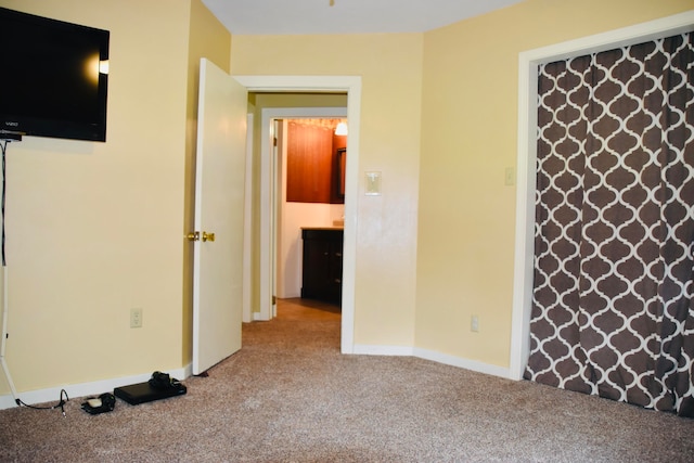 unfurnished bedroom with carpet flooring