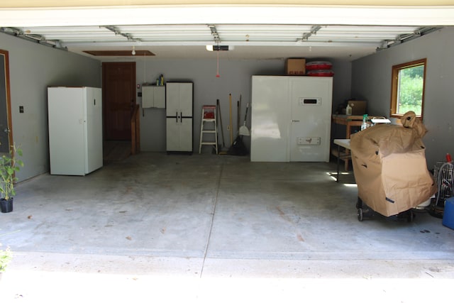 garage featuring white fridge