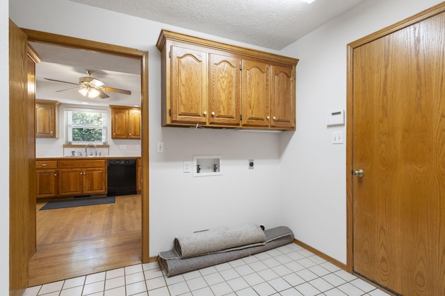 laundry area with washer hookup, light tile patterned floors, a textured ceiling, cabinets, and electric dryer hookup