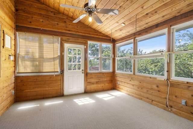 unfurnished sunroom featuring lofted ceiling, wood ceiling, and ceiling fan