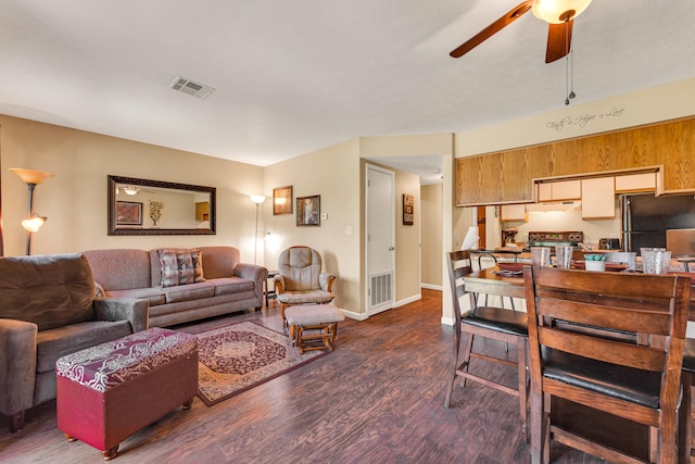 living room featuring ceiling fan and wood-type flooring