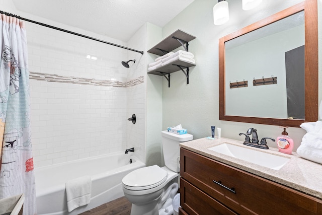 full bathroom featuring hardwood / wood-style floors, vanity, shower / tub combo, and toilet