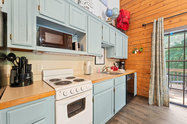 kitchen featuring sink, wooden walls, dishwasher, dark hardwood / wood-style floors, and white electric range oven